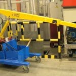 Electric crane for handling molds in the tire production sector.