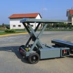 Radio-controlled trolley for handling industrial materials.